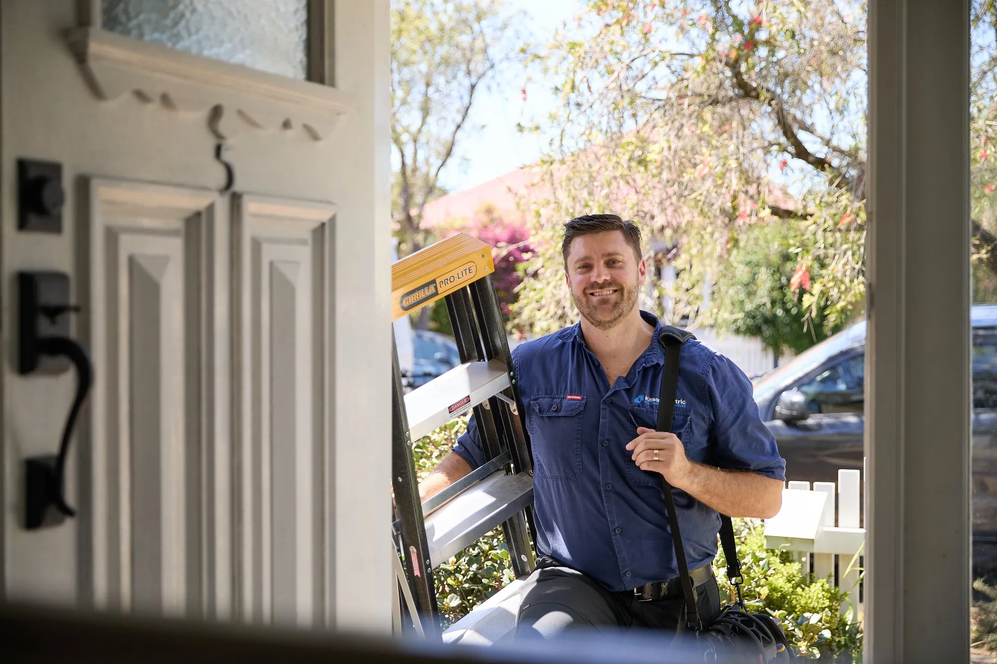 Anthony Kitson arriving at a Newcastle front door with a ladder