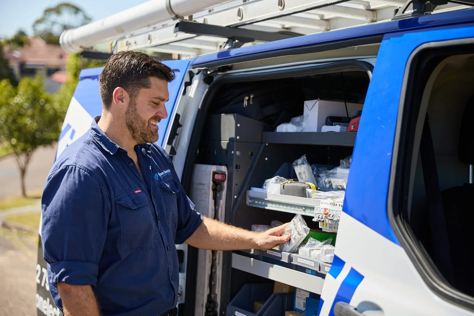 Anthony Kitson picking supplies from the Kitson Electric van