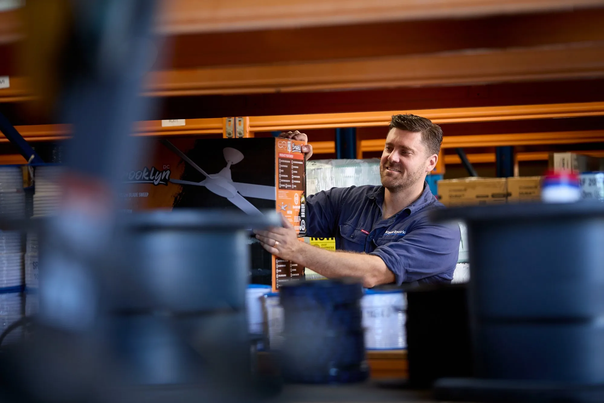 Anthony Kitson picking up parts at an electrical wholesaler