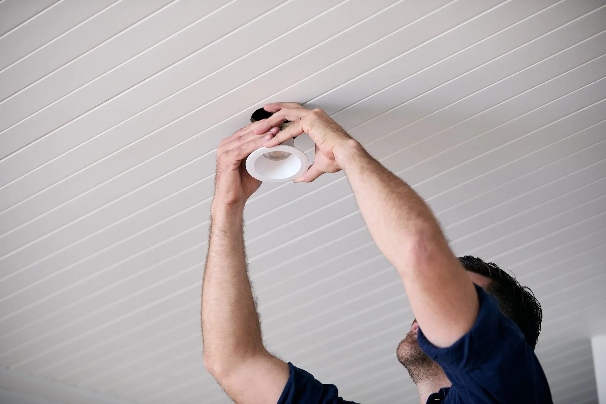 Anthony Kitson fitting a downlight