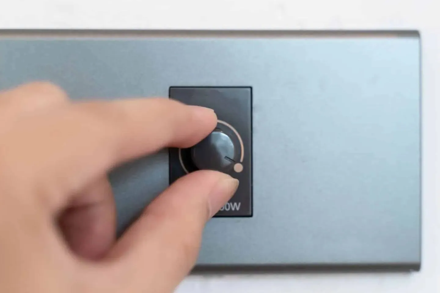 A grey dimmer switch