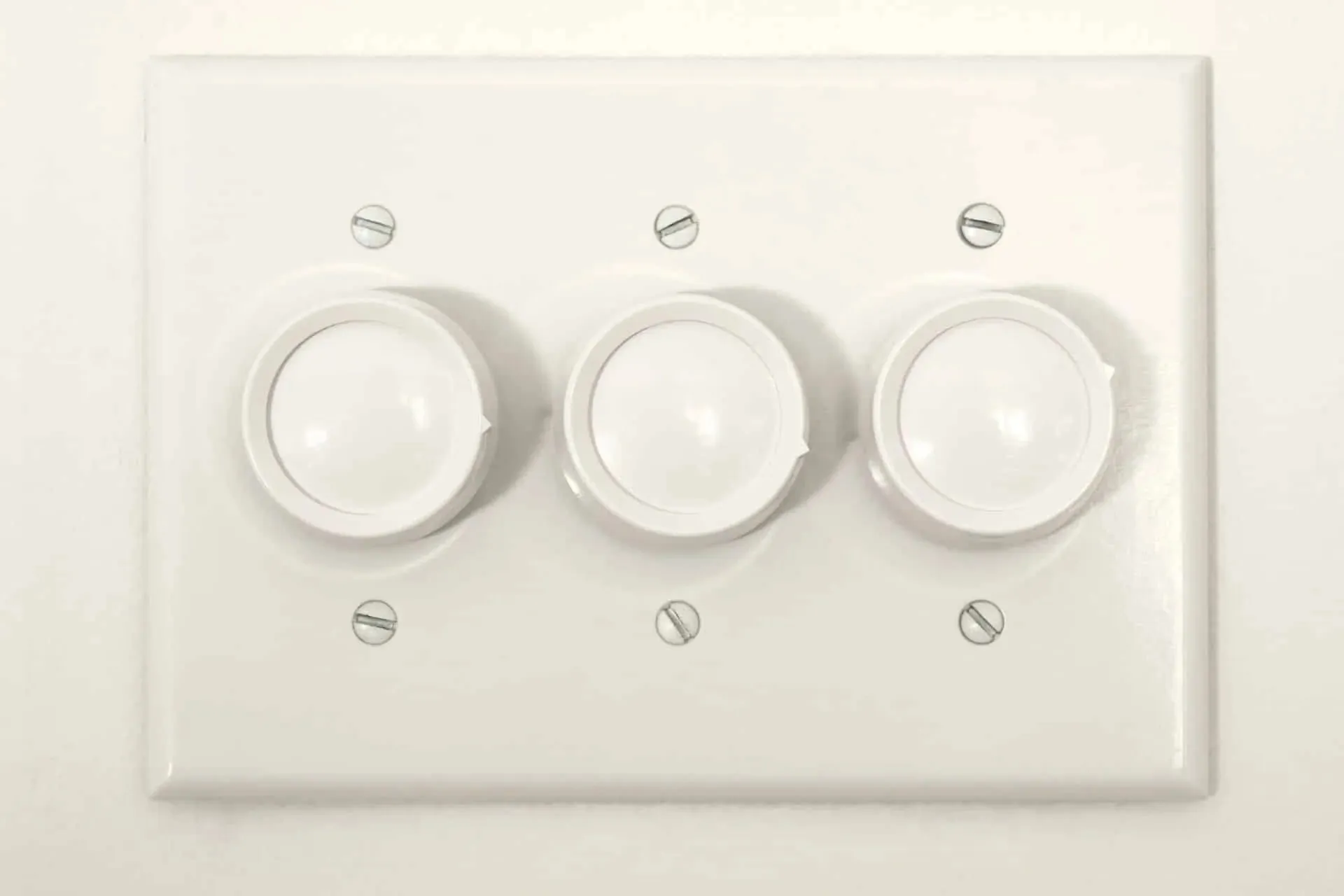A triple dimmer plate