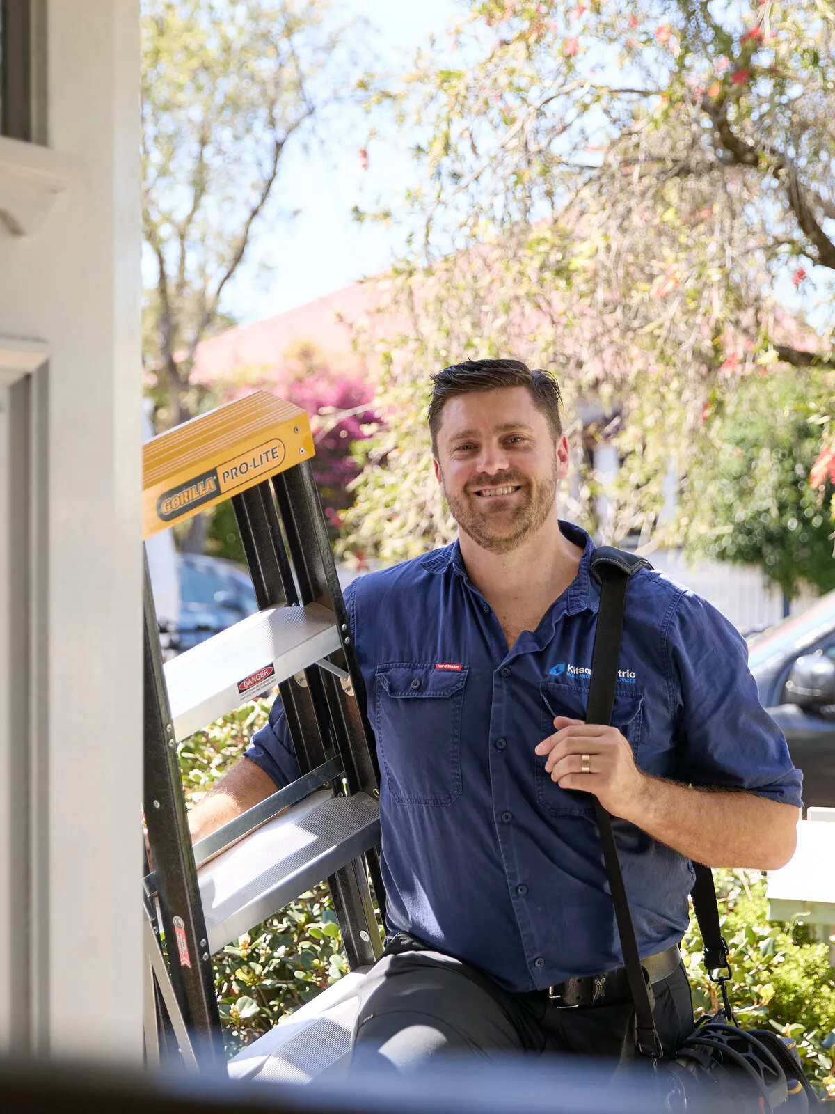 Anthony Kitson arriving at a Newcastle front door with a ladder