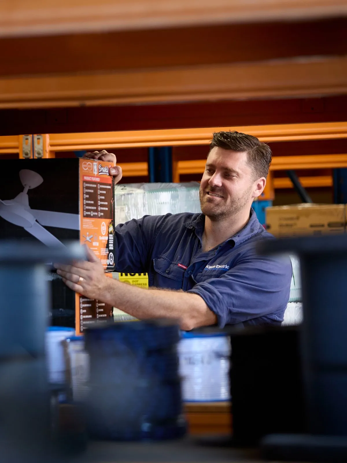Anthony Kitson picking up parts at an electrical wholesaler