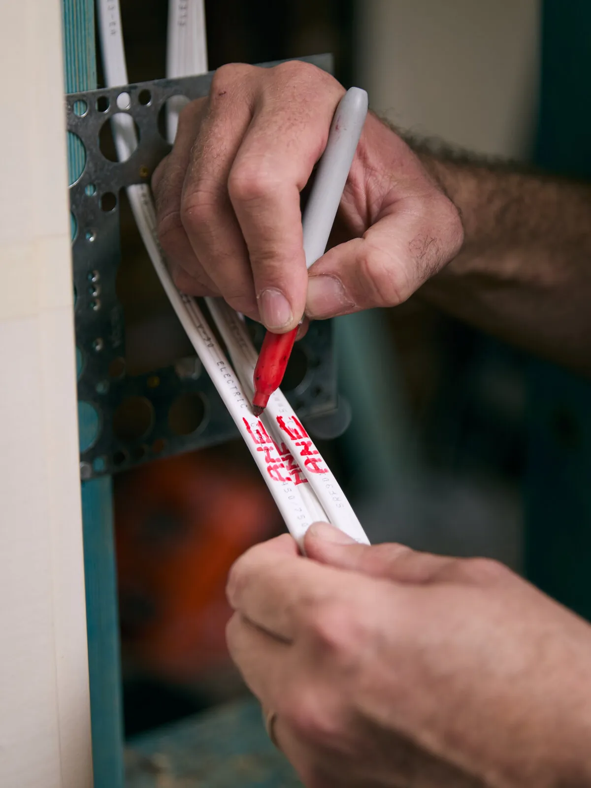 Fixing a cable clip on a Newcastle job