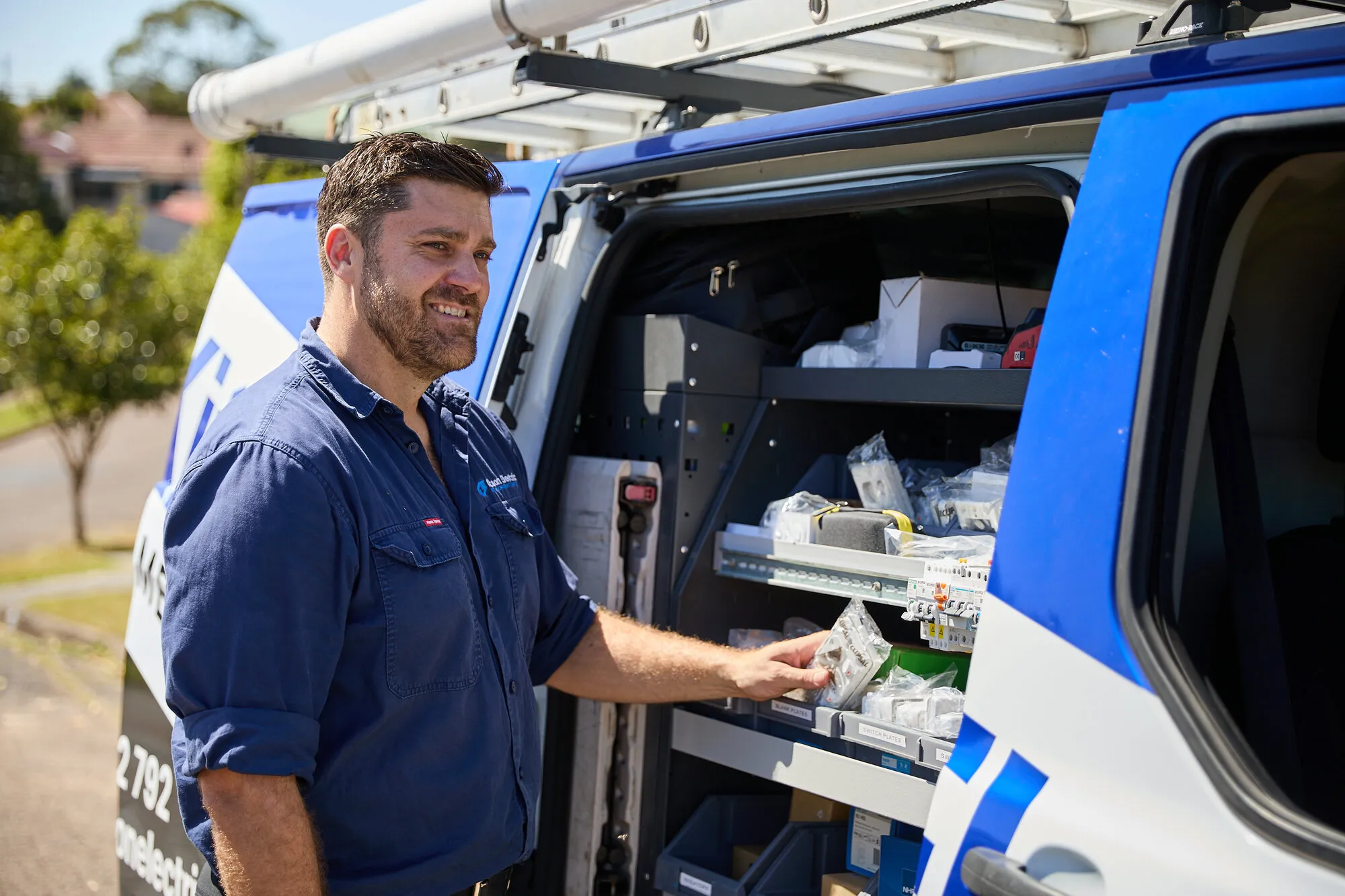 Anthony Kitson loading the Kitson Electric van