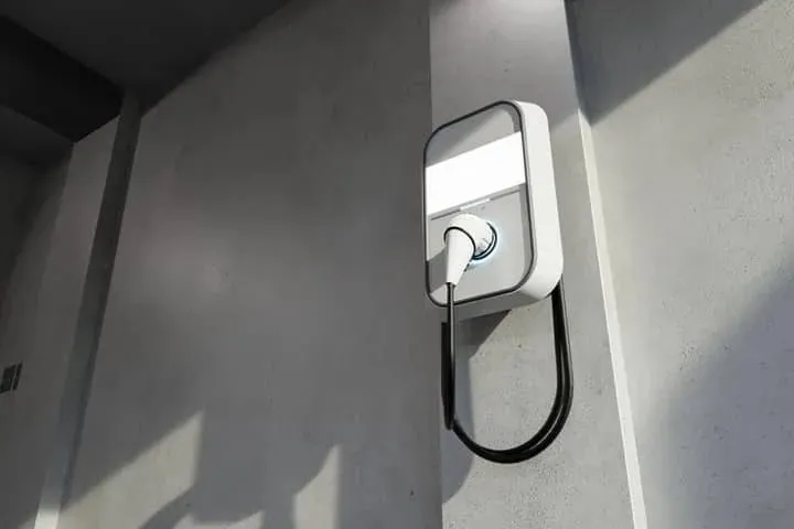 A home EV charger mounted in a garage