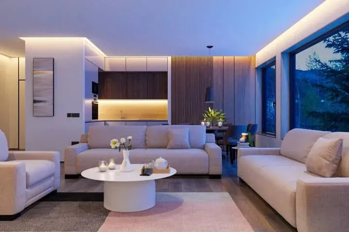 A living room lit with concealed LED lighting