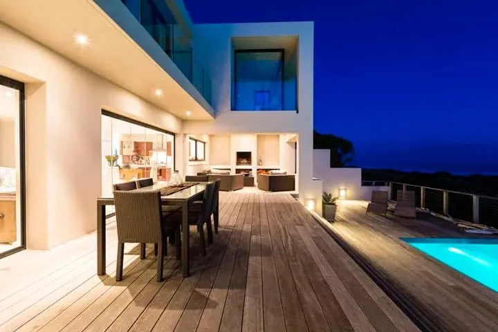 Outdoor lighting on a deck by a pool