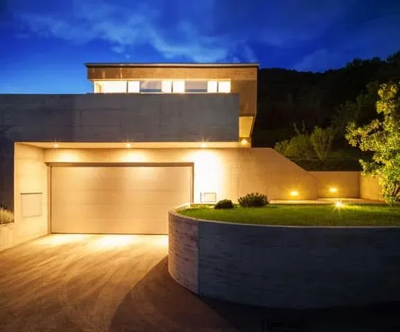 Outdoor lighting on a house front at dusk