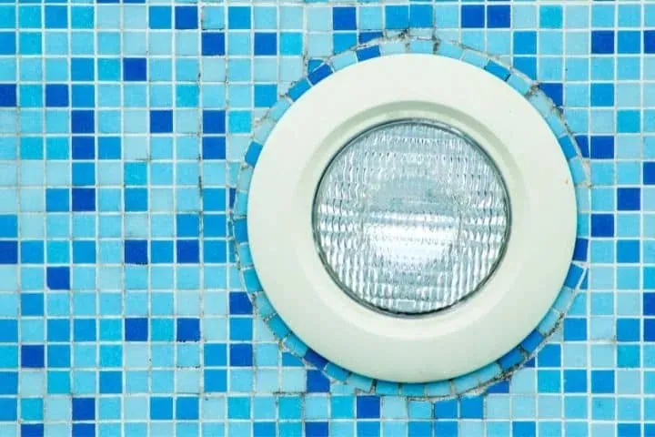 A pool light in mosaic tiles