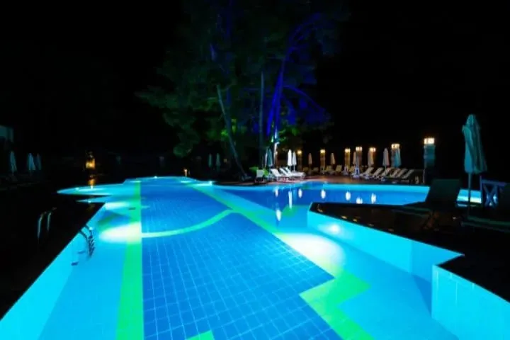 A pool lit at night