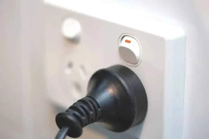 A plug in a wall power point