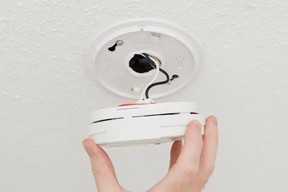 A smoke alarm with the cover off