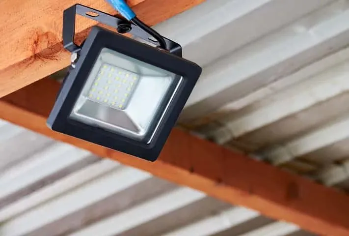 A spotlight on a timber beam