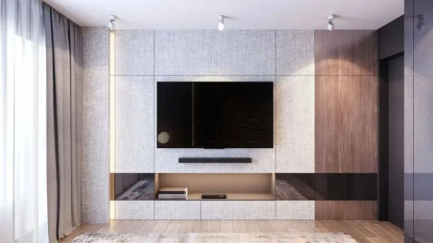 A wall-mounted TV in a lounge